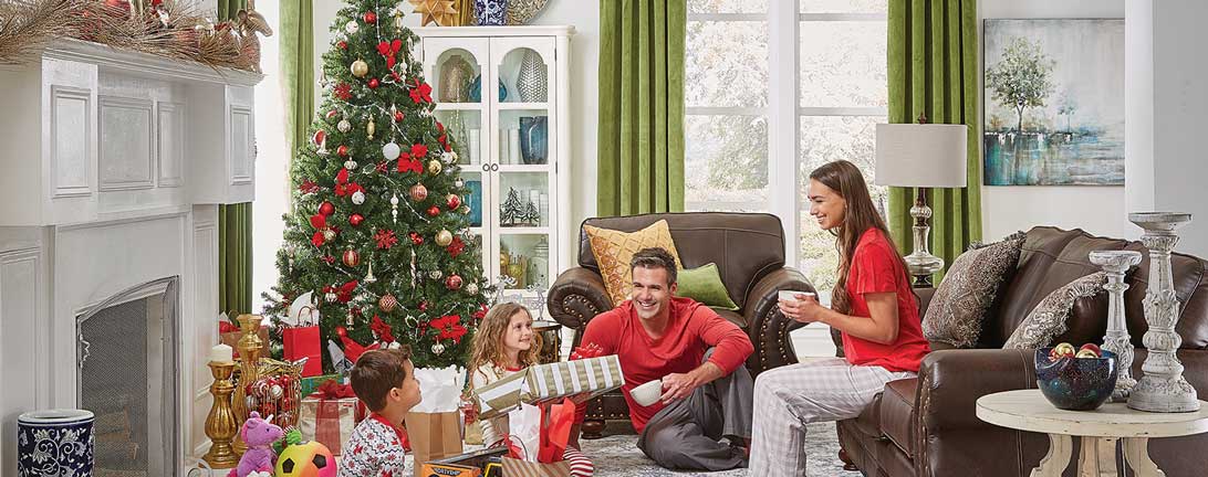 Image of family around the christmas tree